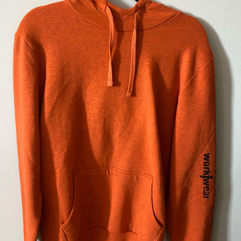 ORANGE HOODIE. WARM AND NEVER TRIED ON. SIZE IS MEDIUM